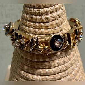 VINTAGE KRAMER OF NEW YORK GOLD AND BLACK FLORAL FLEUR DE LIS BRACELET UNSIGNED